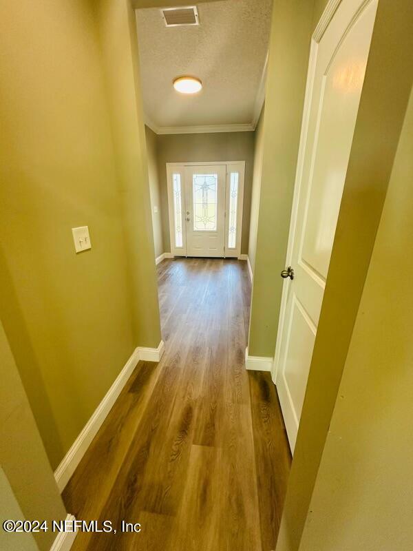 868 Jones Road Jacksonville, FL 32220 - Photo 9 of 19 a view of a room with wooden door