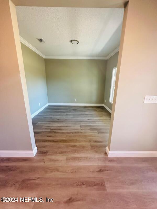 868 Jones Road Jacksonville, FL 32220 - Photo 10 of 19 a view of a room with wooden floor