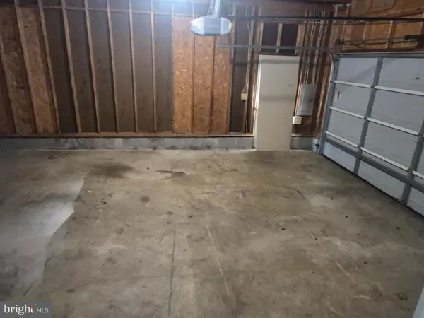 a view of an empty room with wooden walls