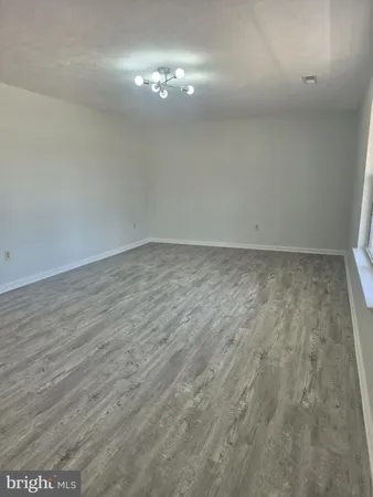 a large kitchen with cabinets and stainless steel appliances