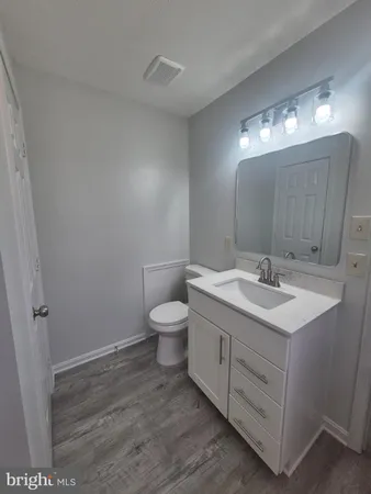 a bedroom with bed and a dresser
