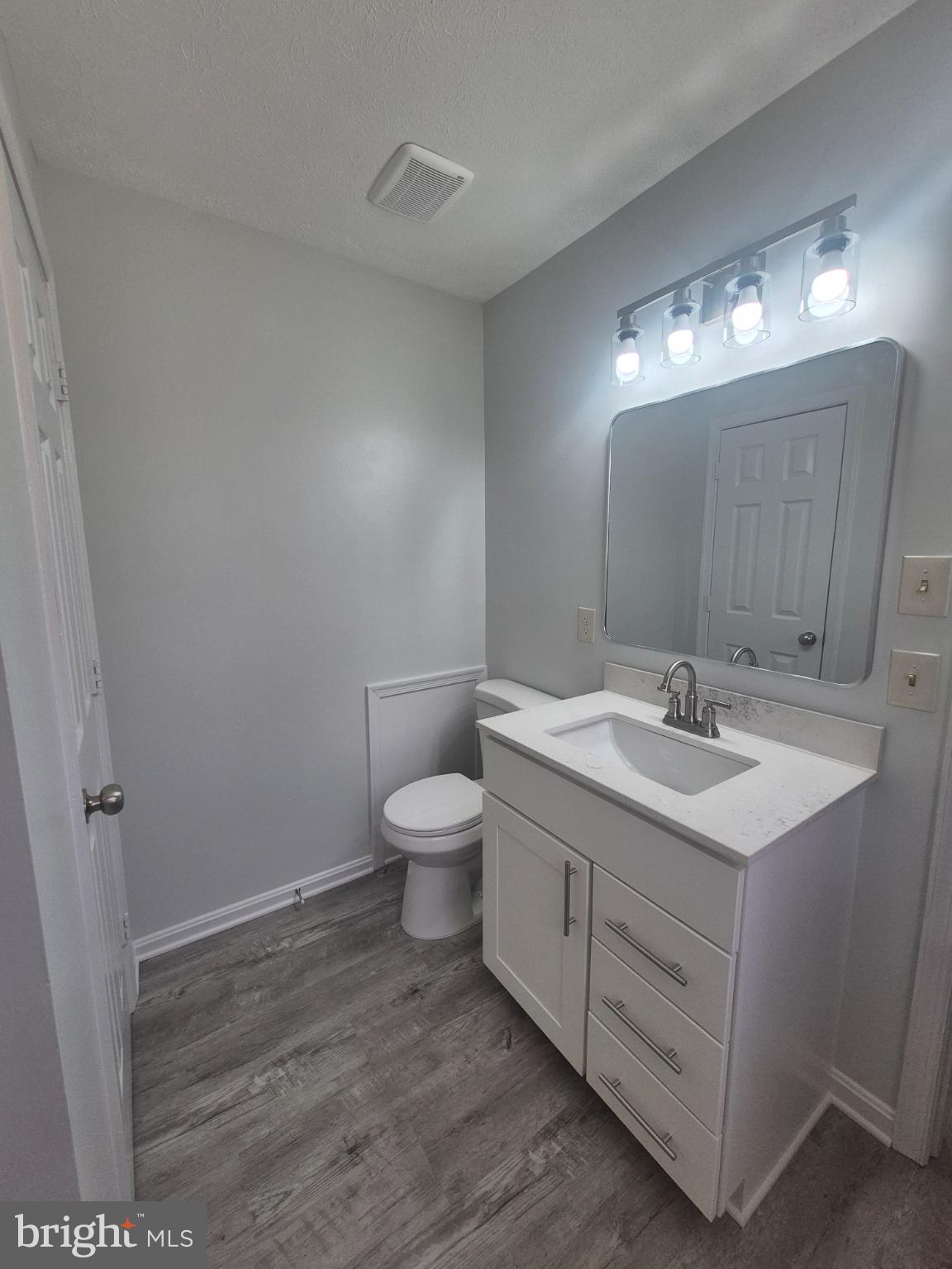 2855 Stavors Road Waldorf, MD 20603 - Photo 20 of 34 a bathroom with a toilet sink and mirror
