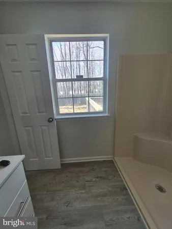a bathroom with a bath tub