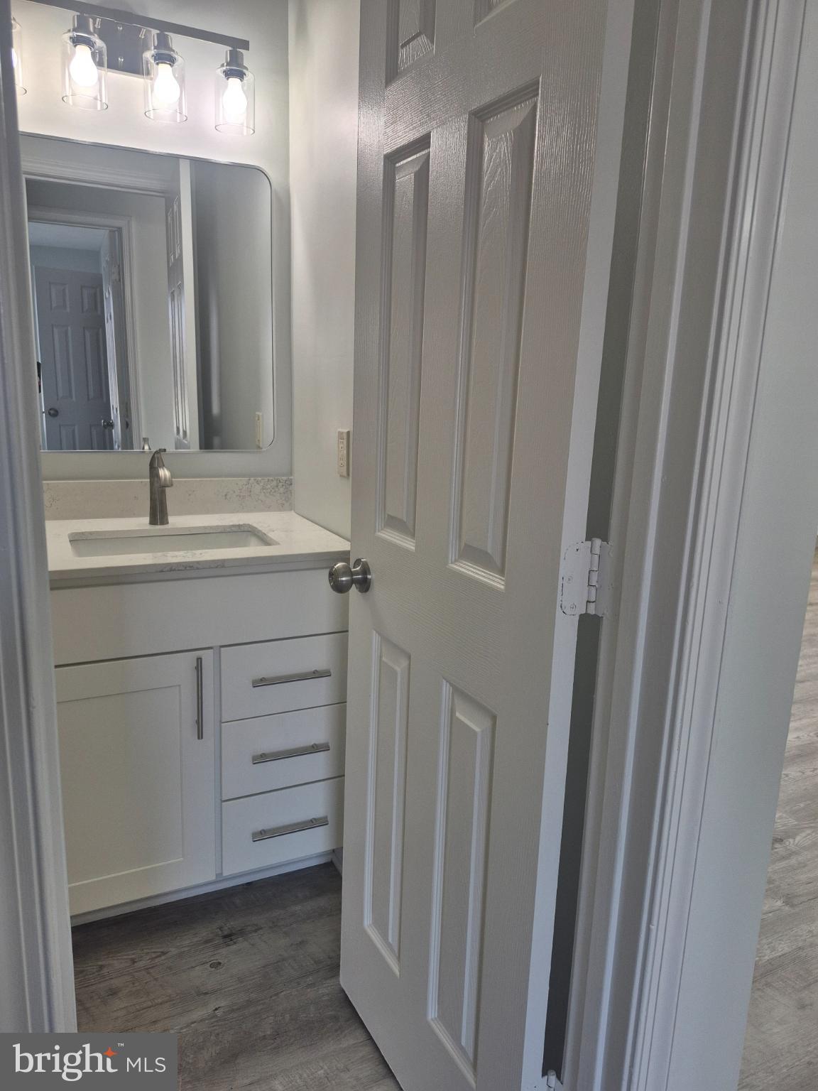2855 Stavors Road Waldorf, MD 20603 - Photo 31 of 34 a bathroom with a double vanity sink and mirror