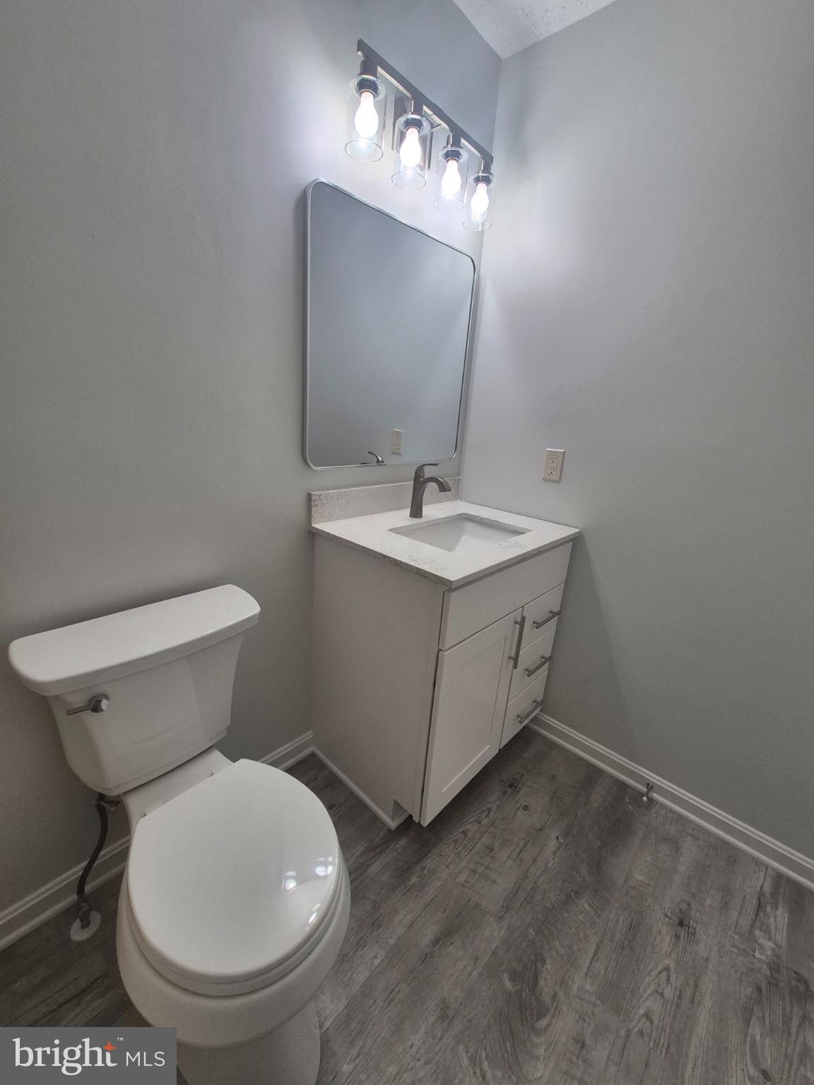 2855 Stavors Road Waldorf, MD 20603 - Photo 32 of 34 a bathroom with a toilet sink and mirror