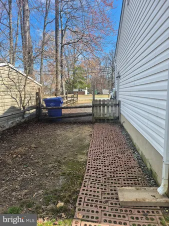 a view of balcony with wooden floor and fence
