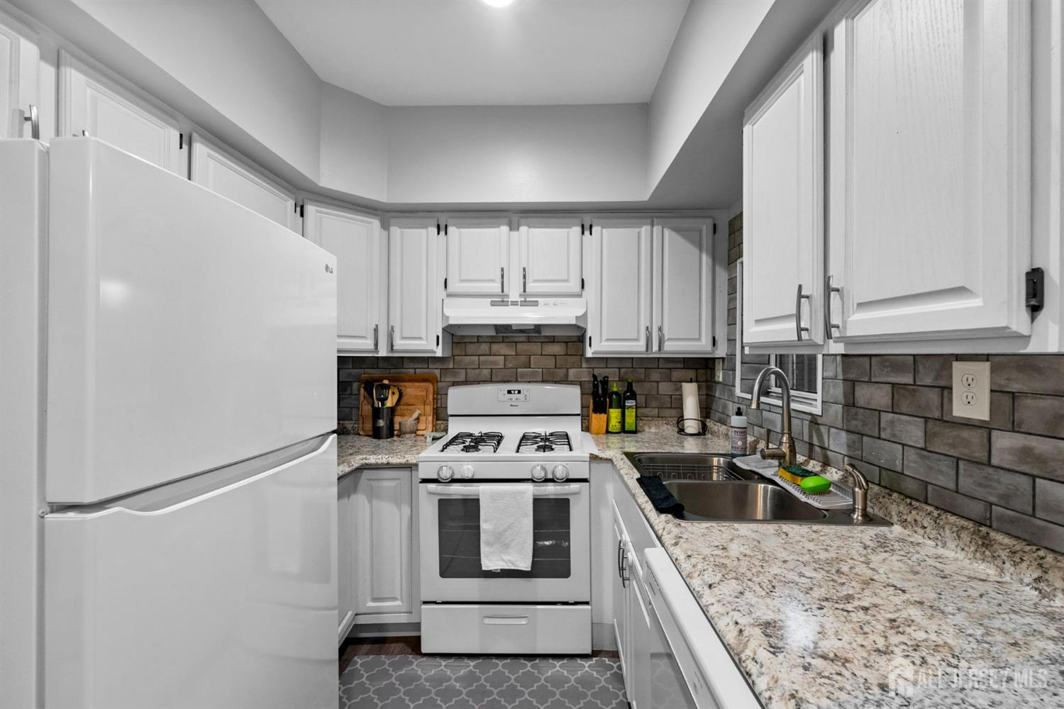 436 Hunt Avenue Hamilton, NJ 08610 - Photo 12 of 40 a kitchen with stainless steel appliances granite countertop a refrigerator sink stove and microwave
