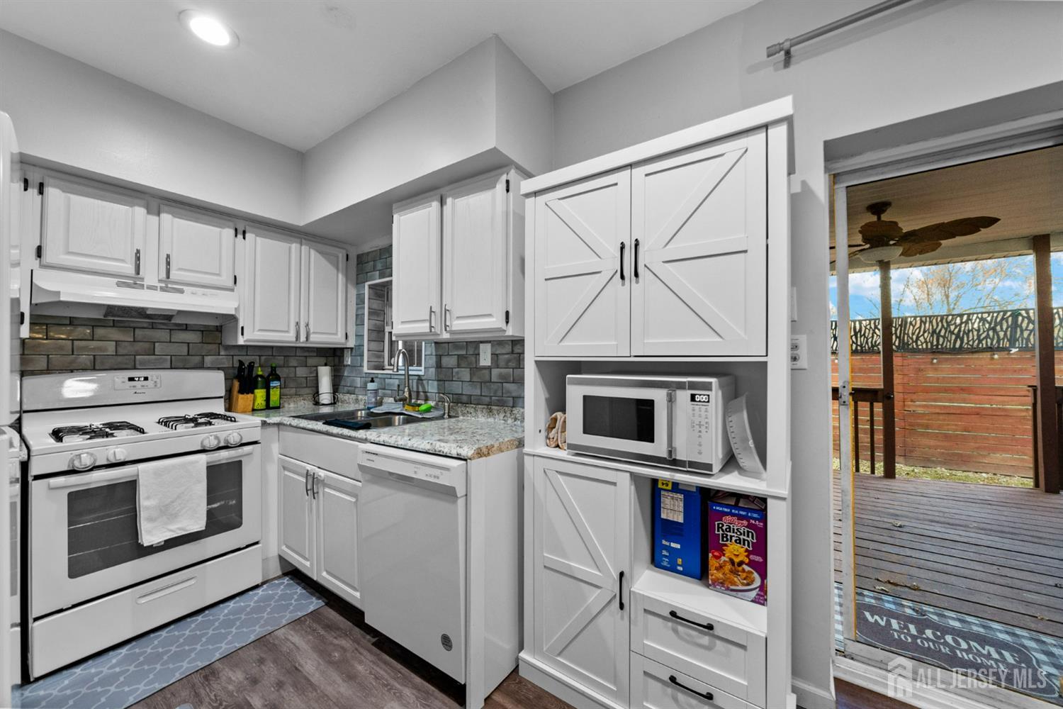 436 Hunt Avenue Hamilton, NJ 08610 - Photo 13 of 40 a kitchen with white cabinets and appliances