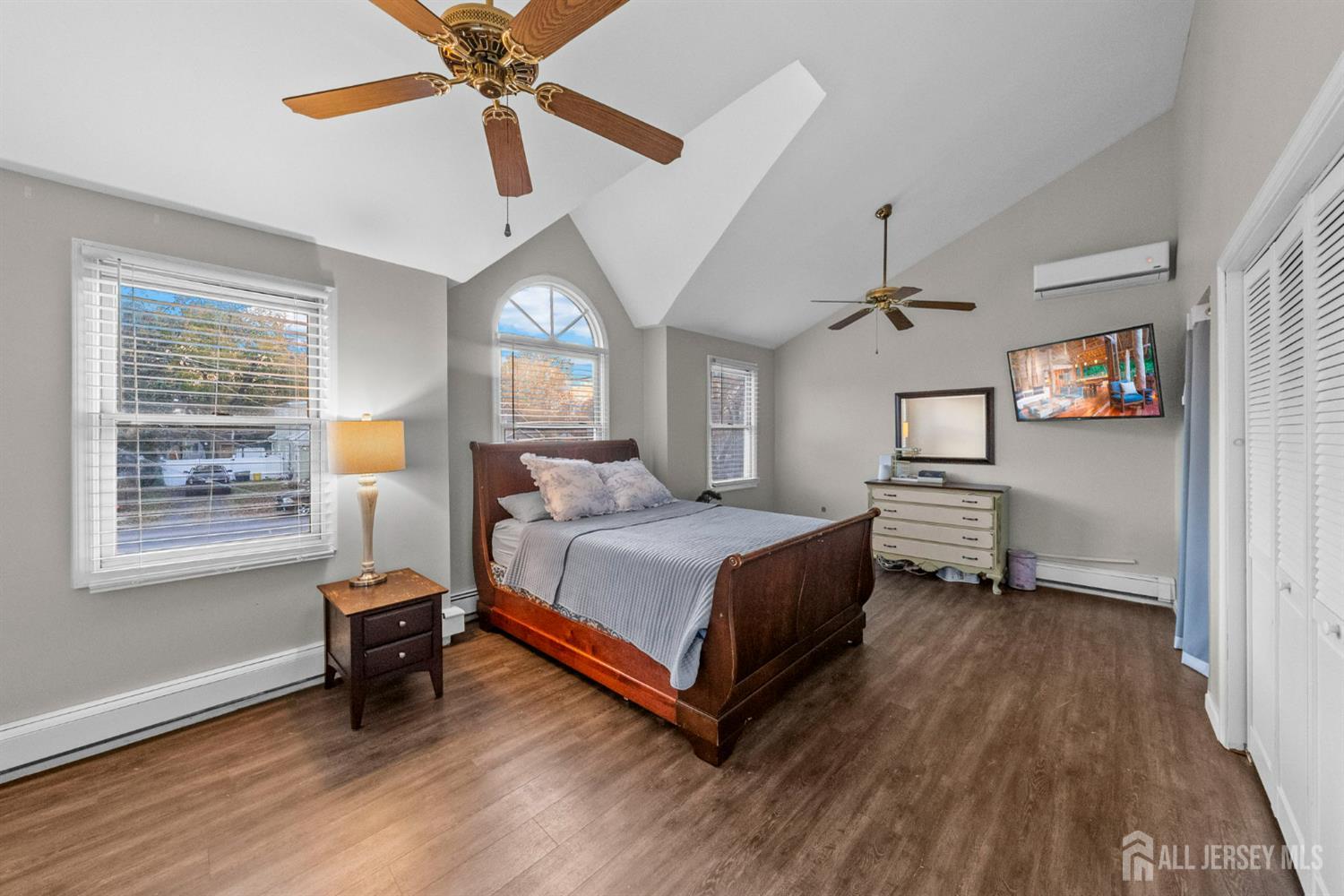 436 Hunt Avenue Hamilton, NJ 08610 - Photo 17 of 40 a spacious bedroom with a bed and a chandelier