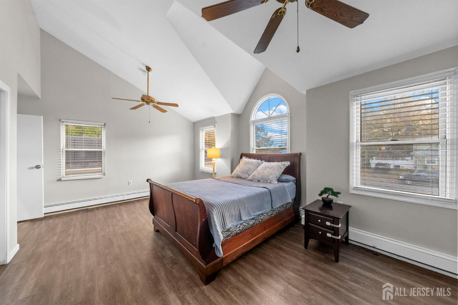 436 Hunt Avenue Hamilton, NJ 08610 - Photo 19 of 40 a bedroom with a bed wooden floor and window
