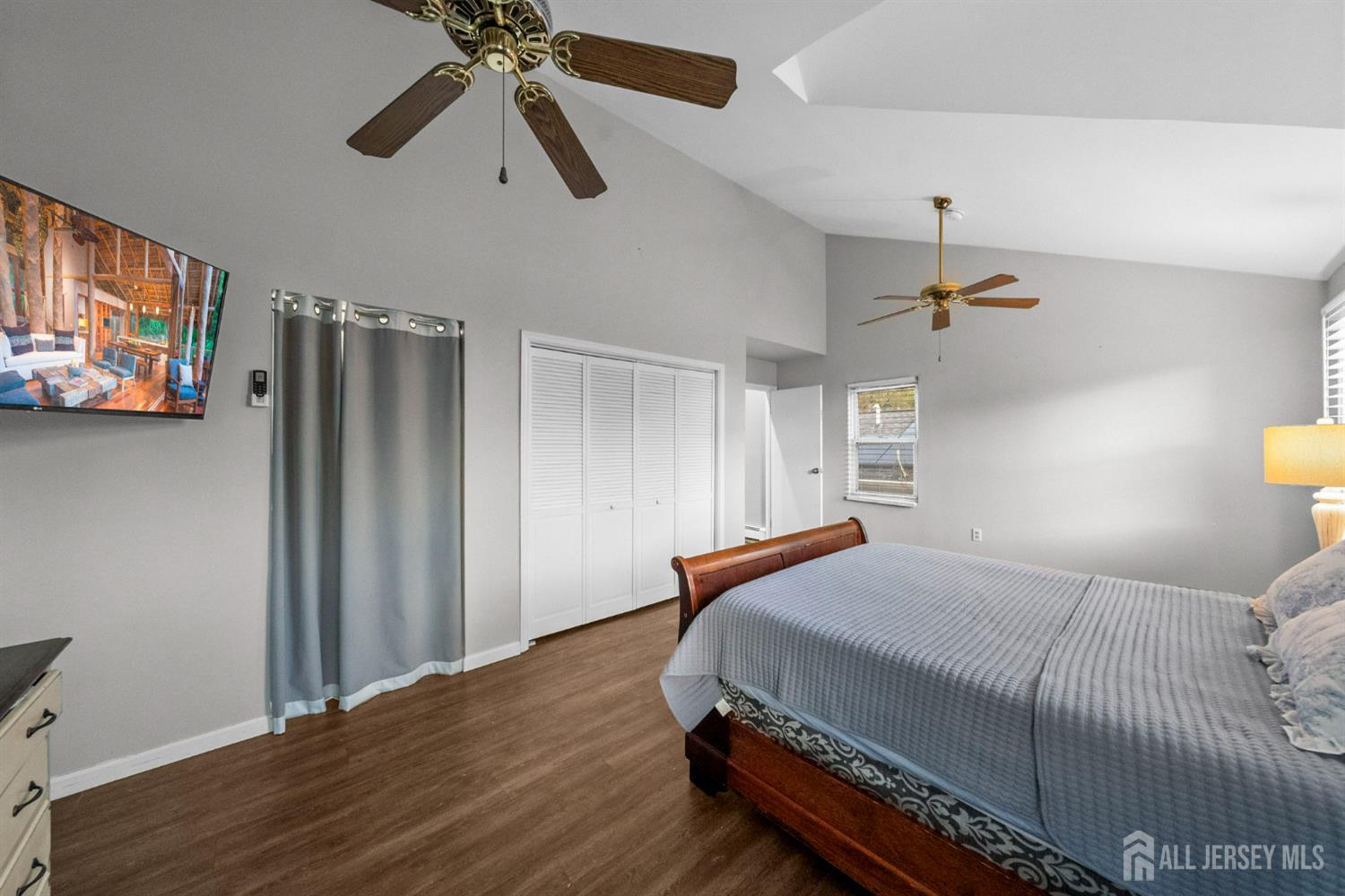 436 Hunt Avenue Hamilton, NJ 08610 - Photo 20 of 40 a bedroom with a bed and a chandelier