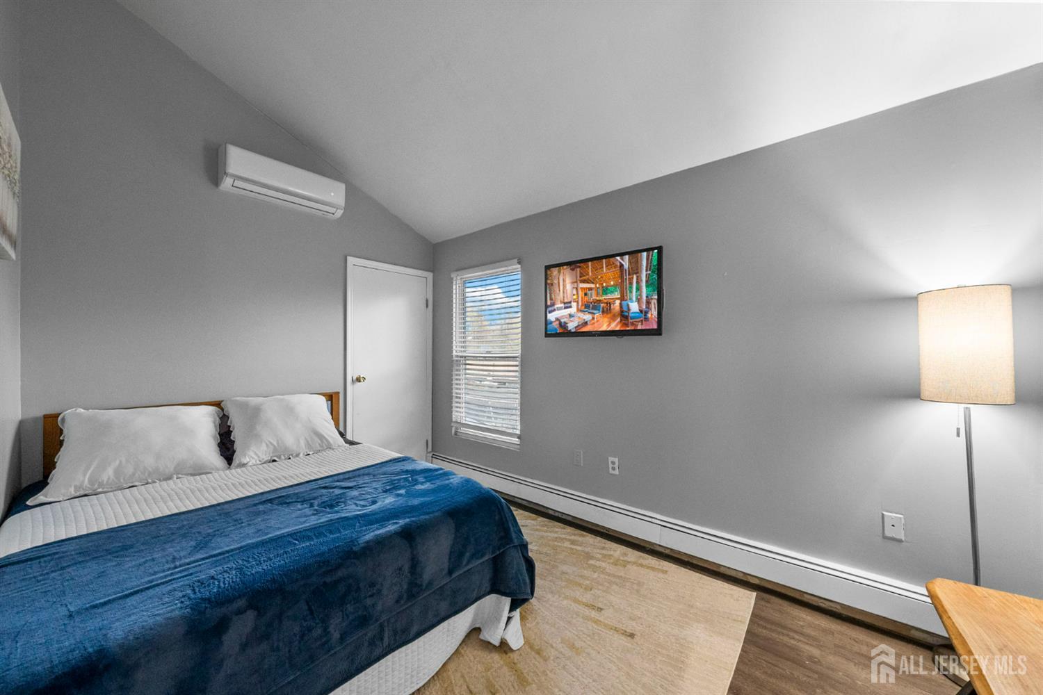 436 Hunt Avenue Hamilton, NJ 08610 - Photo 22 of 40 a bedroom with a bed and night stand