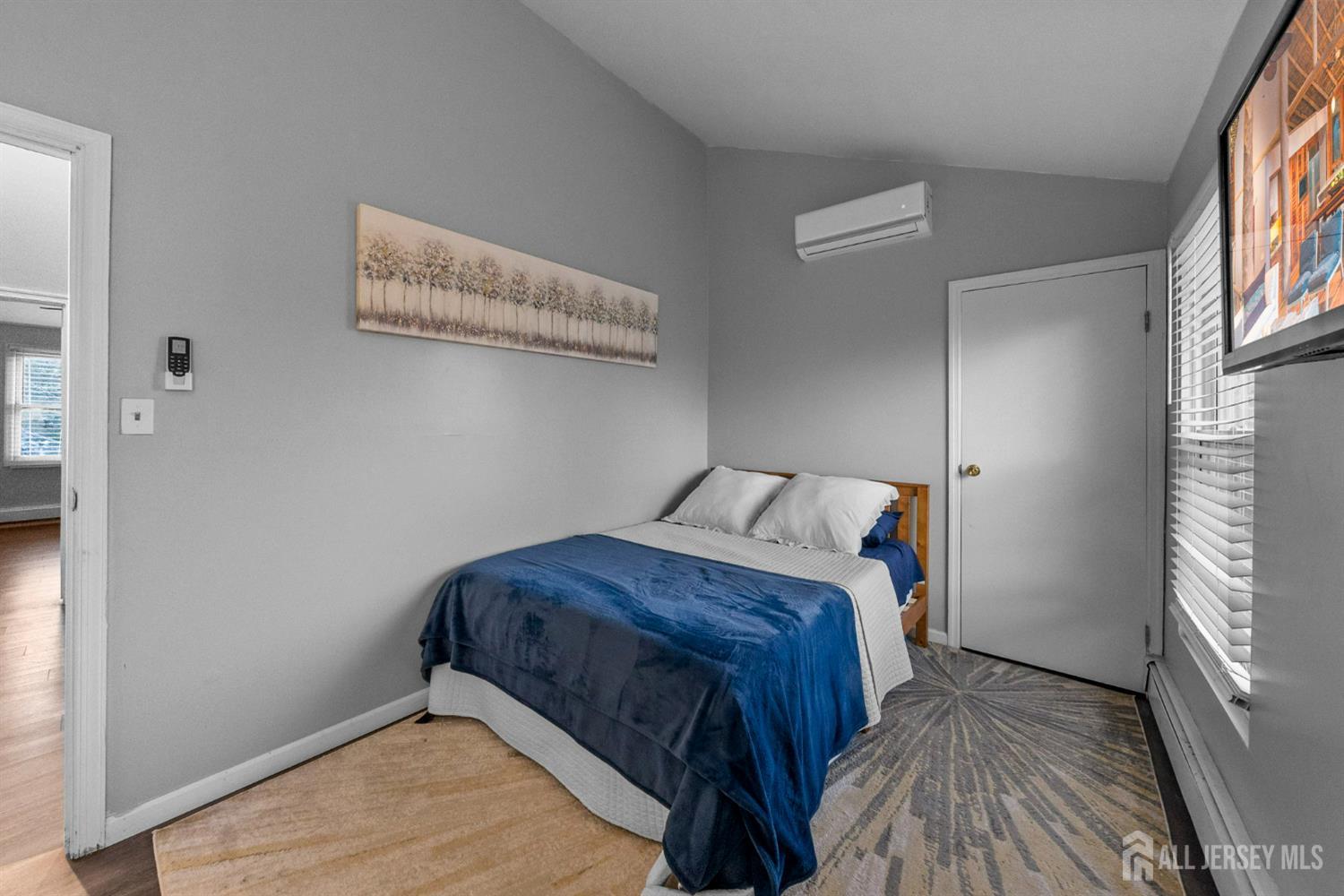 436 Hunt Avenue Hamilton, NJ 08610 - Photo 23 of 40 a bedroom with a bed and window