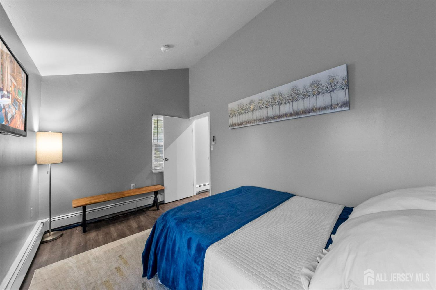 436 Hunt Avenue Hamilton, NJ 08610 - Photo 24 of 40 a bedroom with a bed and lamp