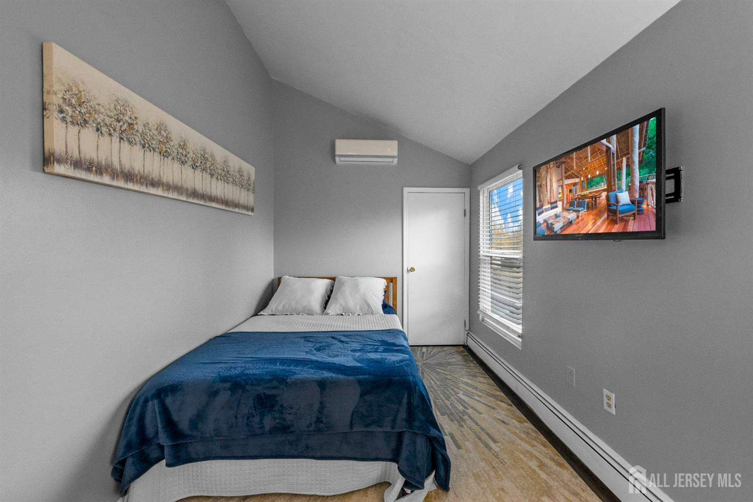 436 Hunt Avenue Hamilton, NJ 08610 - Photo 25 of 40 a bed sitting in a bedroom next to a window
