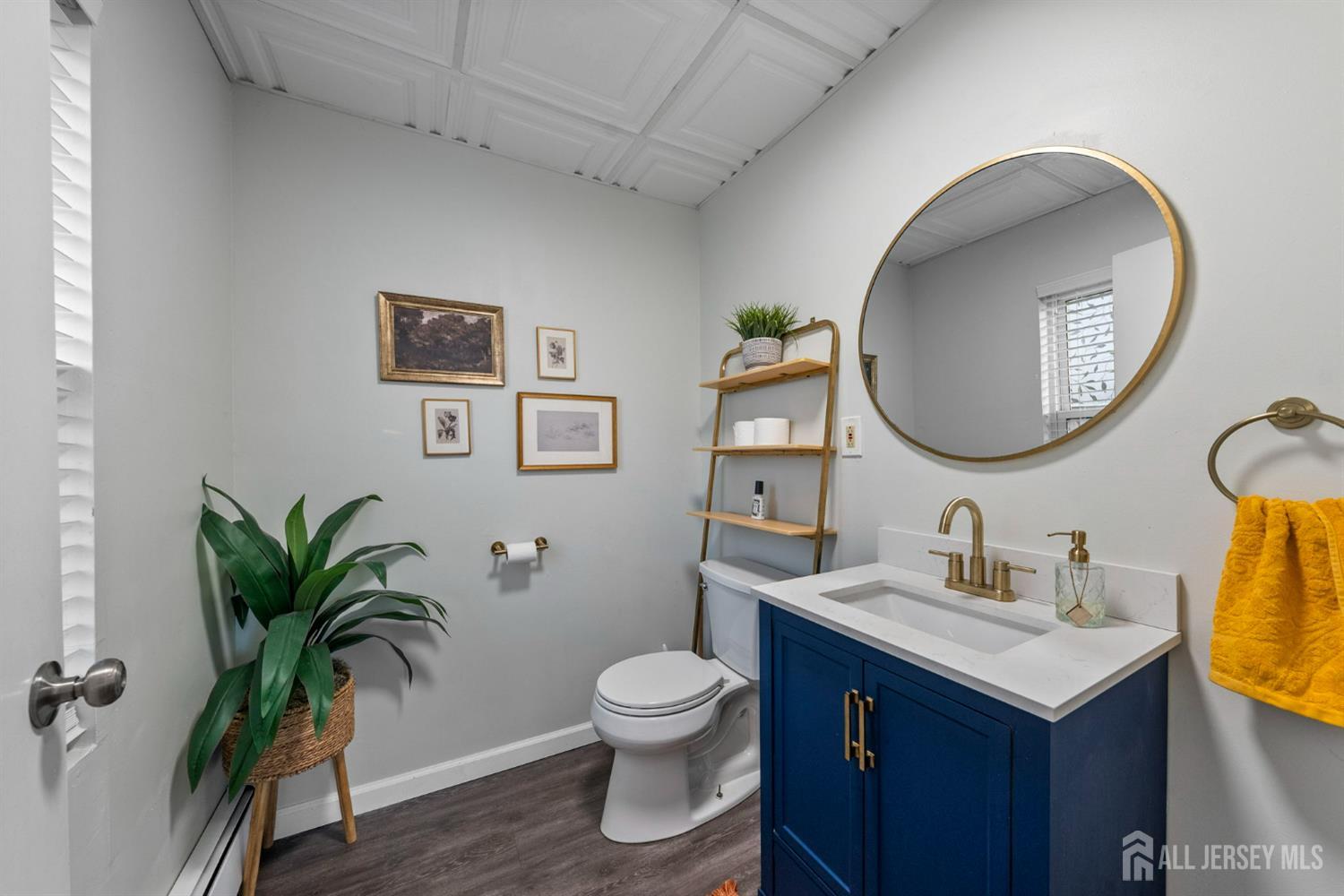 436 Hunt Avenue Hamilton, NJ 08610 - Photo 28 of 40 a bathroom with a toilet a sink and a mirror