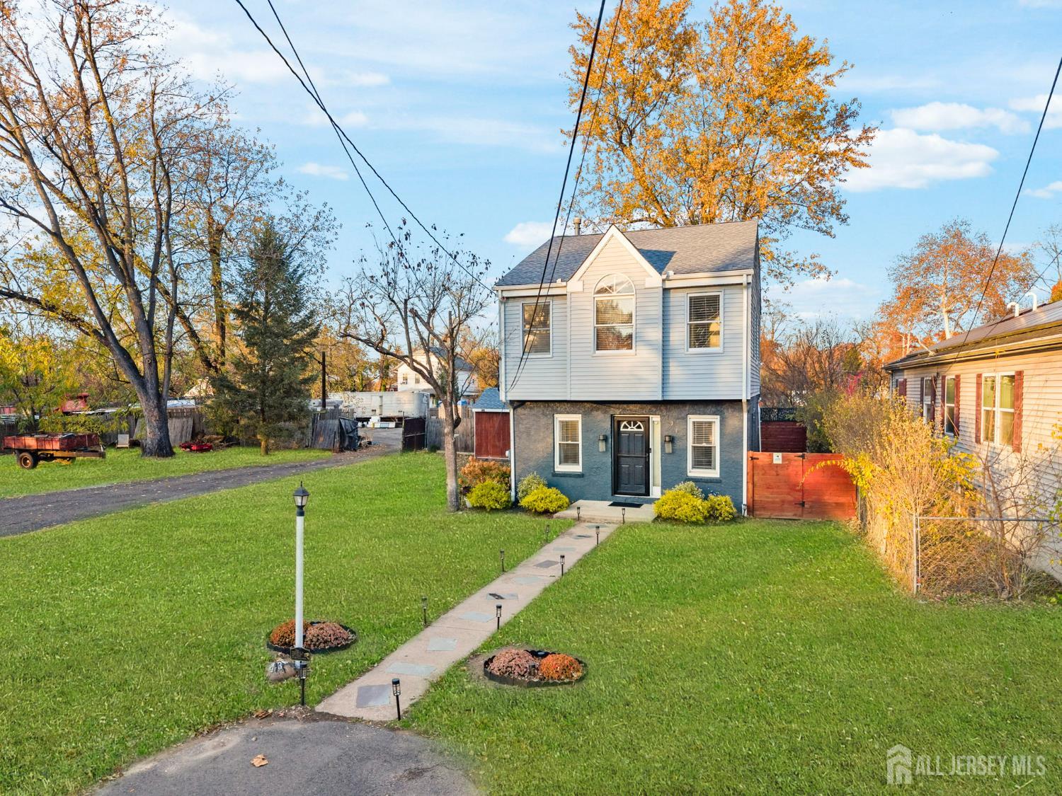 436 Hunt Avenue Hamilton, NJ 08610 - Photo 4 of 40 a front view of a house with garden and trees