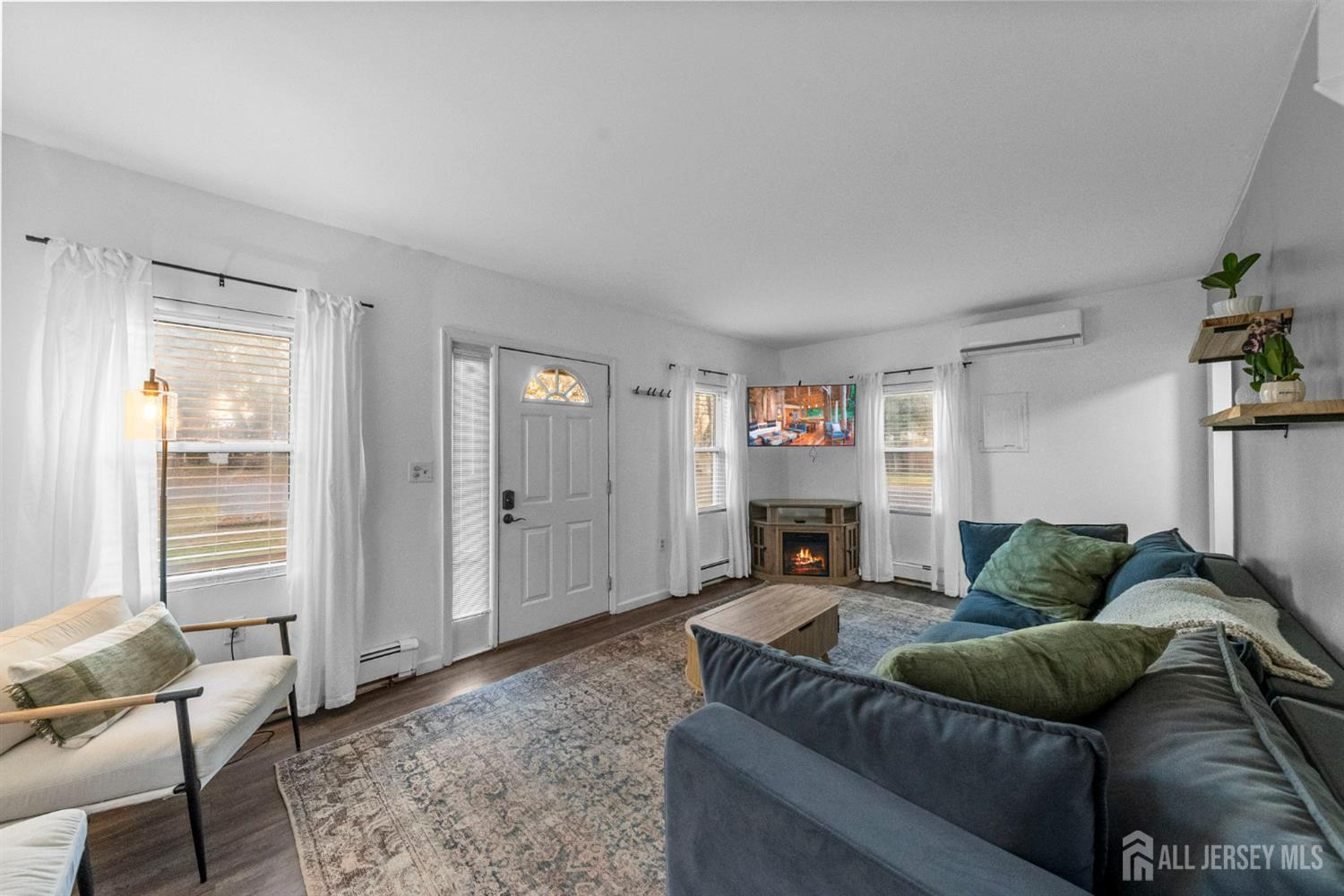 436 Hunt Avenue Hamilton, NJ 08610 - Photo 5 of 40 a living room with furniture and a fireplace