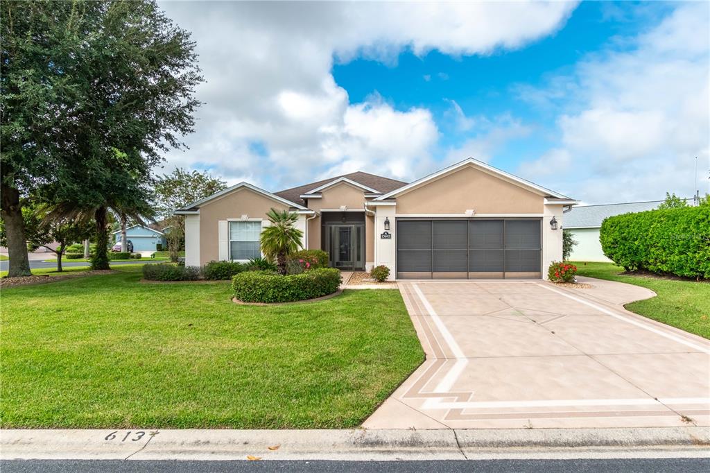 15692 Southwest 11th Court Road Ocala, FL 34473 - Photo 1 of 49 a front view of a house with a yard