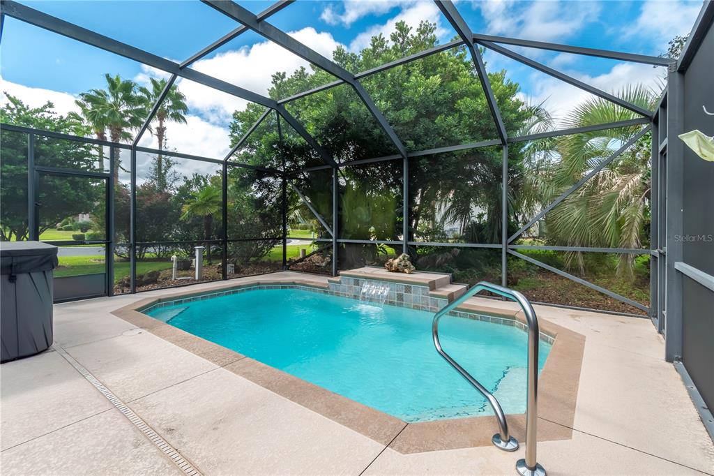 15692 Southwest 11th Court Road Ocala, FL 34473 - Photo 11 of 49 a view of a swimming pool with a patio and a yard