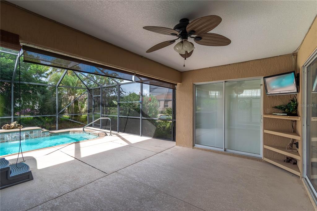 15692 Southwest 11th Court Road Ocala, FL 34473 - Photo 16 of 49 a view of a livingroom with a ceiling fan and a large window