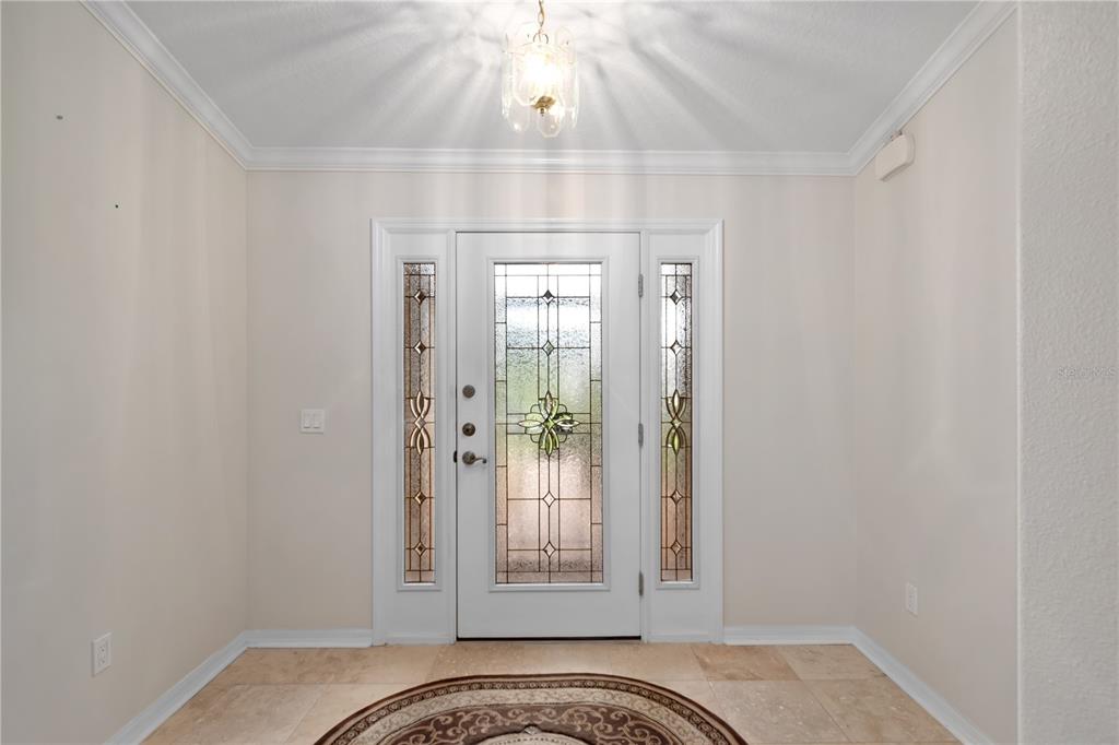 15692 Southwest 11th Court Road Ocala, FL 34473 - Photo 17 of 49 a view of a bedroom with wooden floor and a ceiling fan