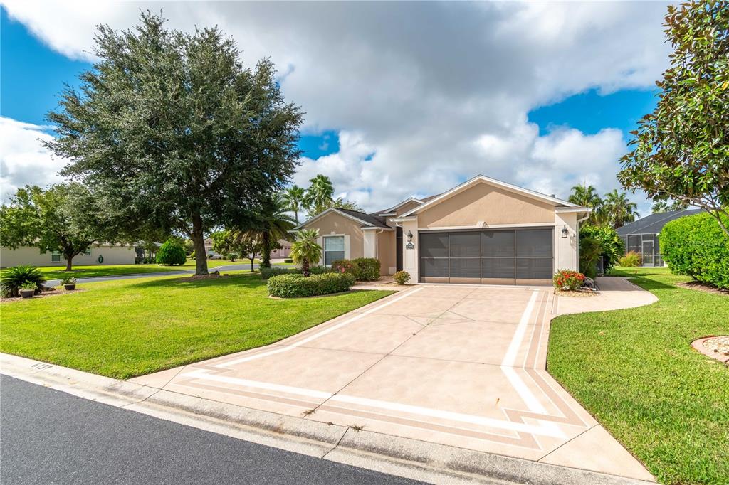 15692 Southwest 11th Court Road Ocala, FL 34473 - Photo 2 of 49 a front view of a house with a yard