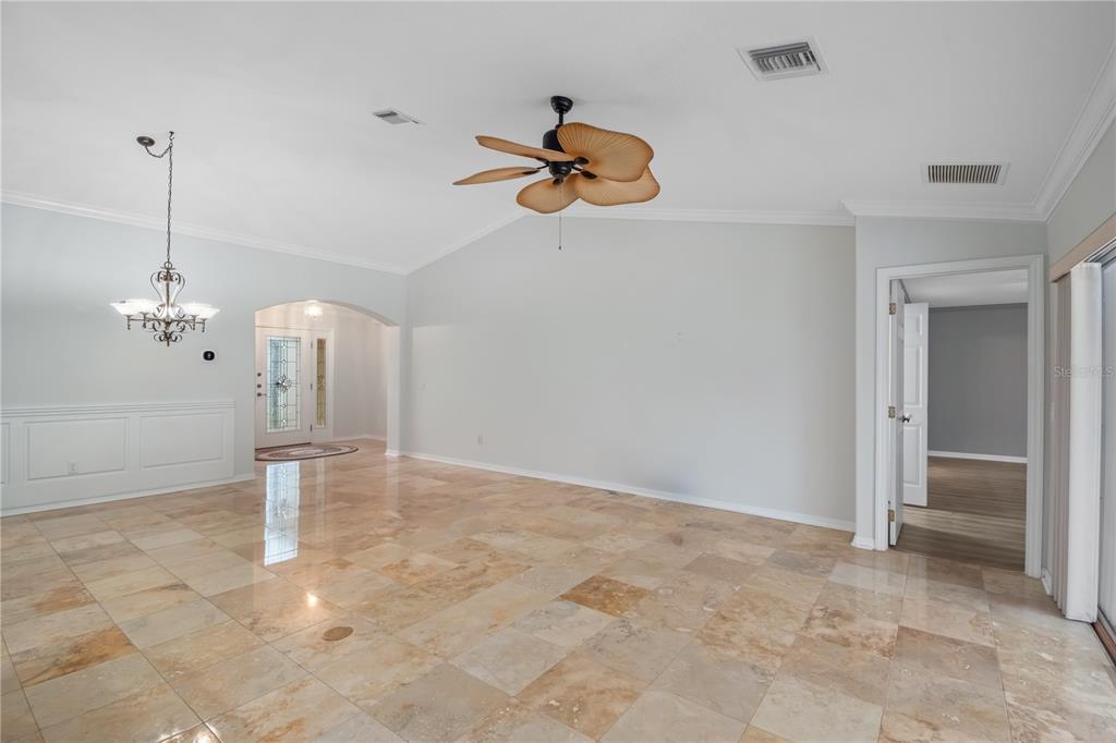 15692 Southwest 11th Court Road Ocala, FL 34473 - Photo 24 of 49 a view of a chandelier fan and refrigerator in a room