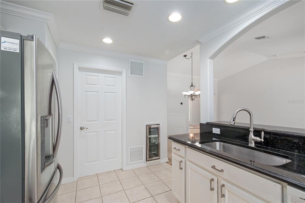 15692 Southwest 11th Court Road Ocala, FL 34473 - Photo 27 of 49 a kitchen with a sink and refrigerator