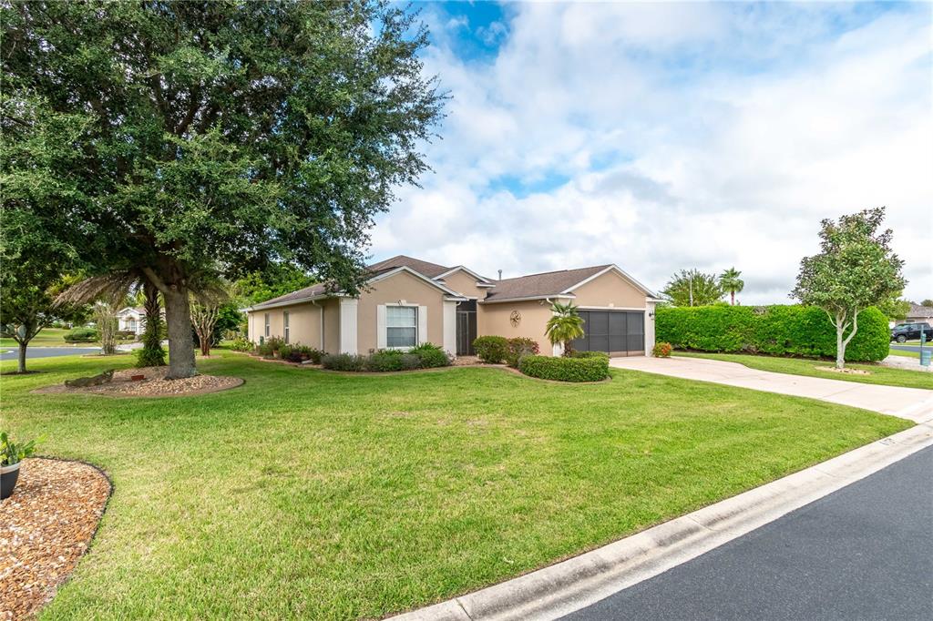 15692 Southwest 11th Court Road Ocala, FL 34473 - Photo 3 of 49 a front view of a house with a yard