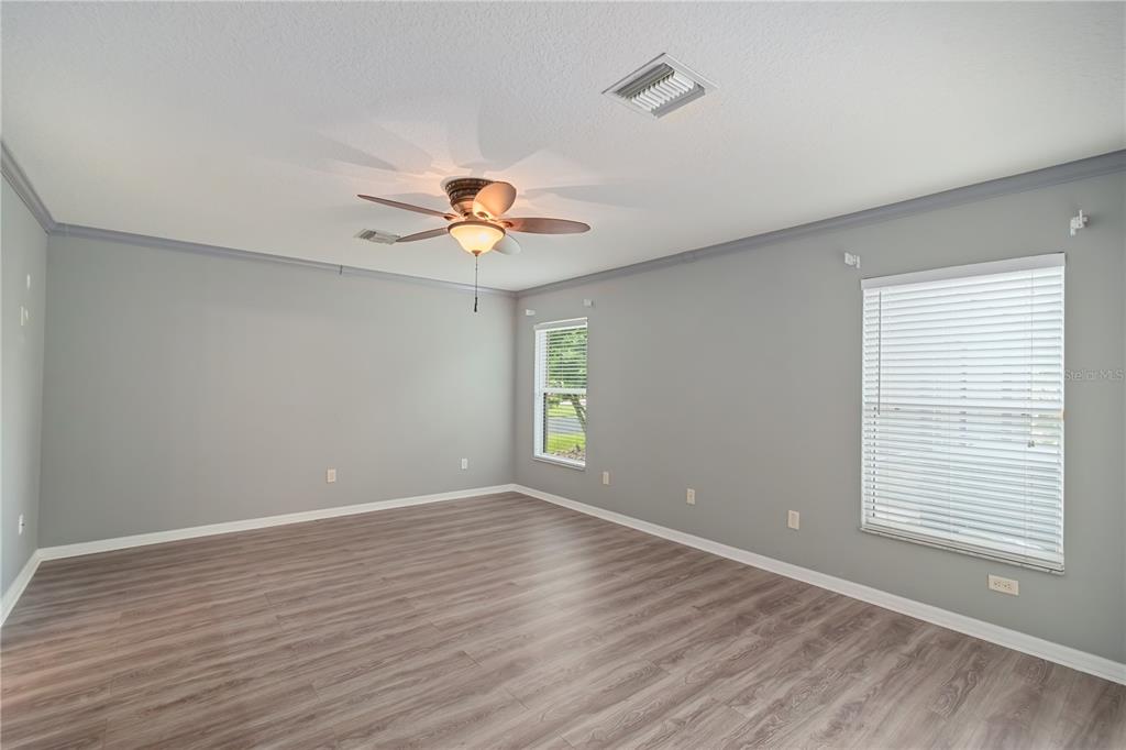 15692 Southwest 11th Court Road Ocala, FL 34473 - Photo 31 of 49 wooden floor in an empty room with a window