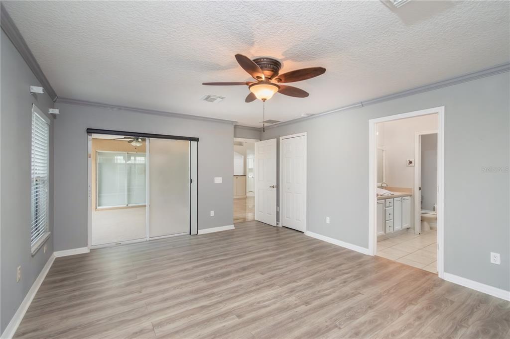 15692 Southwest 11th Court Road Ocala, FL 34473 - Photo 32 of 49 a view of an empty room and window with wooden floor