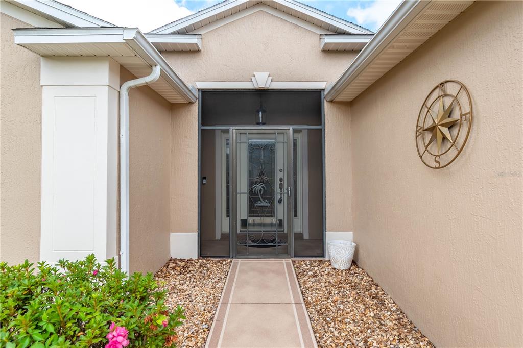 15692 Southwest 11th Court Road Ocala, FL 34473 - Photo 7 of 49 a front view of a house with garden