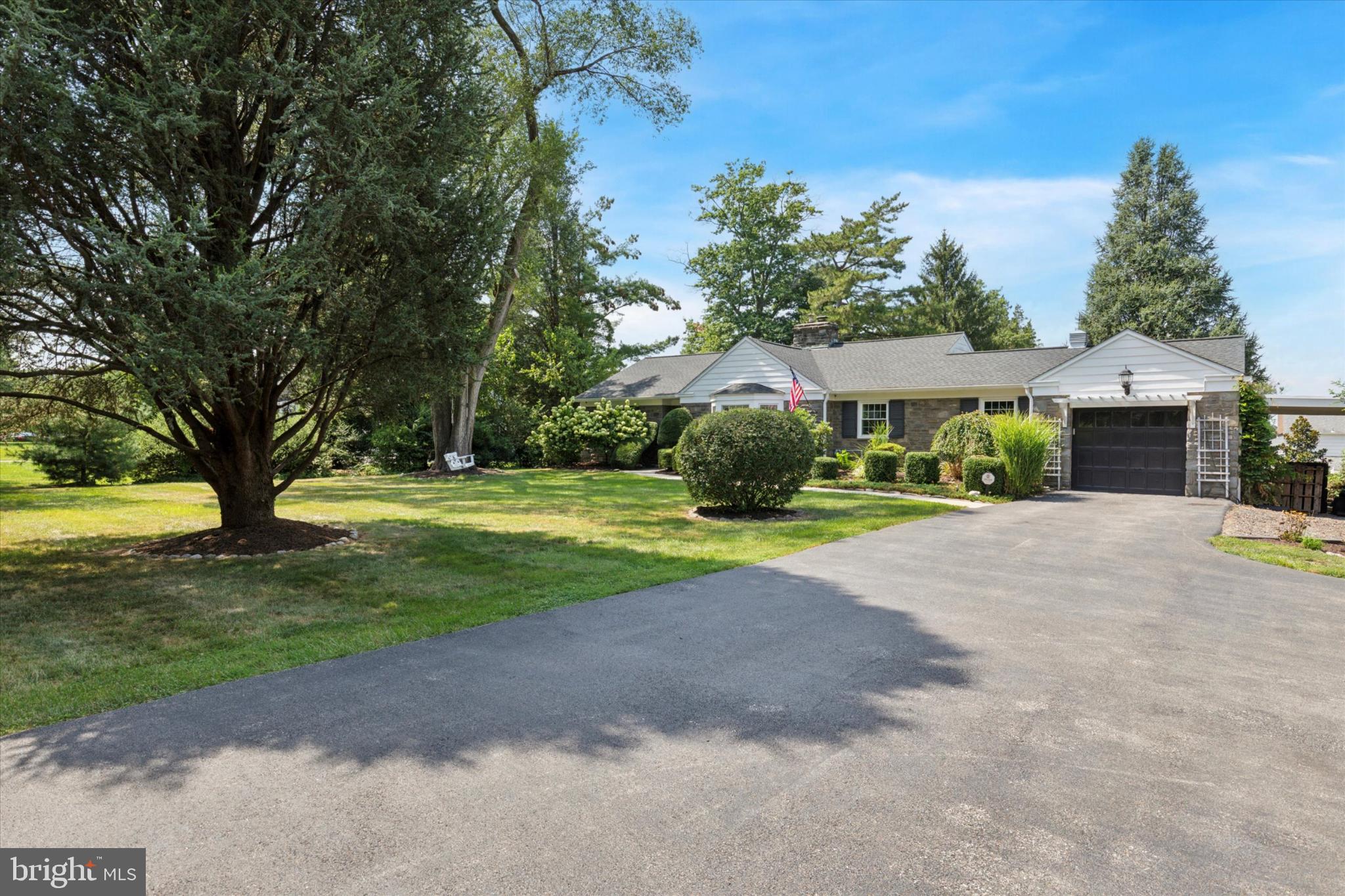 3029 Arch Road Norristown, PA 19401 - Photo 25 of 27 a view of a house with a yard and large trees