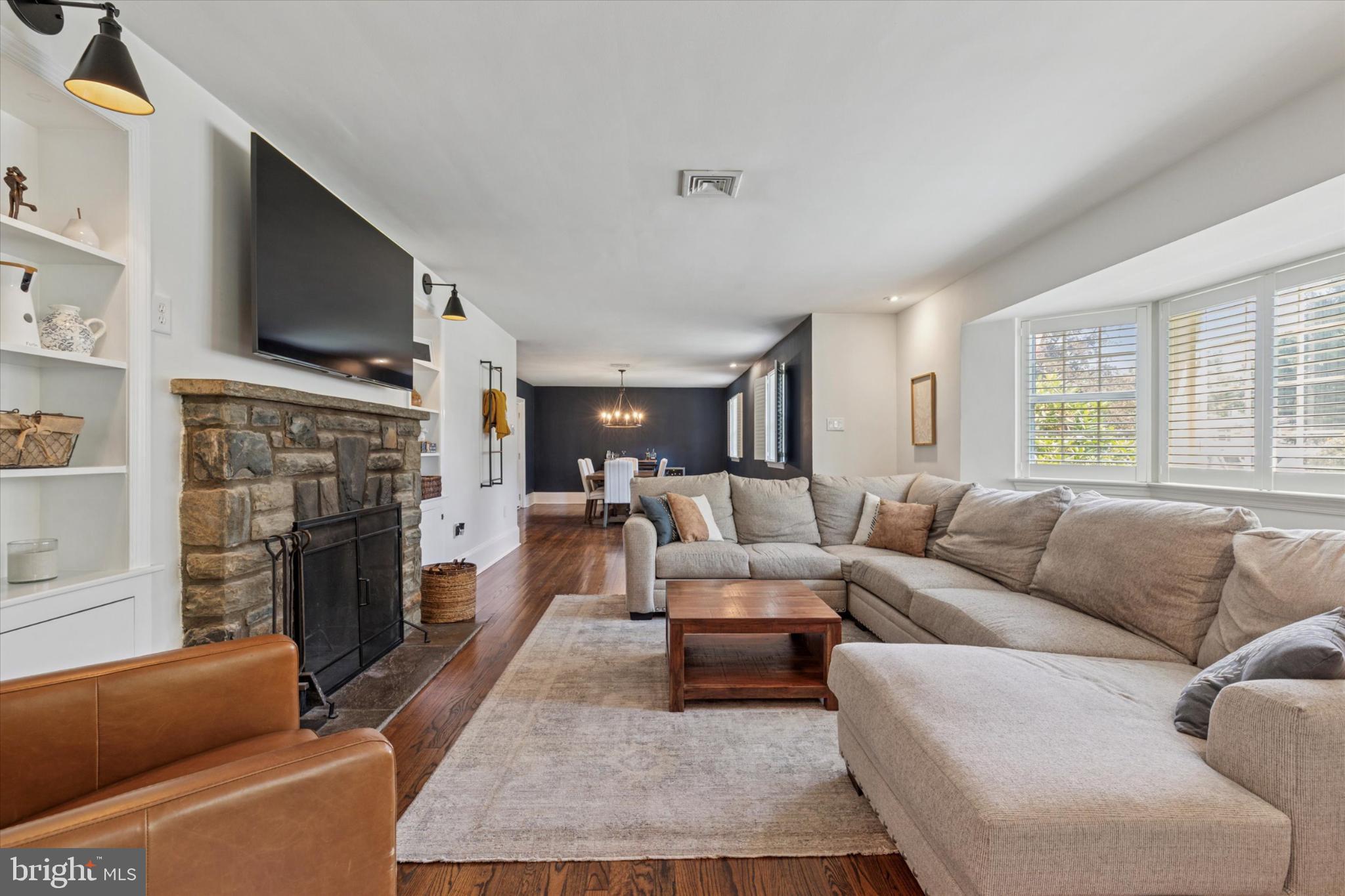 3029 Arch Road Norristown, PA 19401 - Photo 3 of 27 a living room with fireplace furniture and a flat screen tv