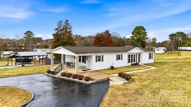 a front view of a house with swimming pool yard and outdoor seating