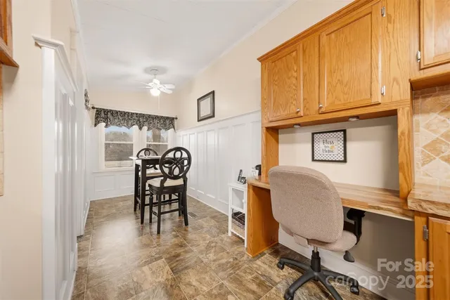 a view of a workspace with furniture