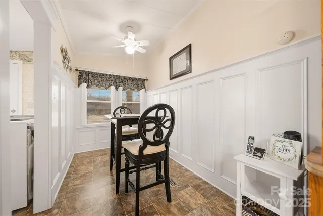 a view of a livingroom with furniture and a bookshelf