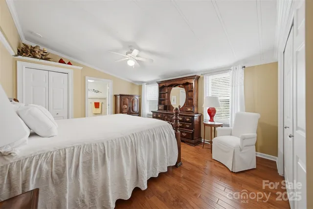 a bedroom with double bed and a window