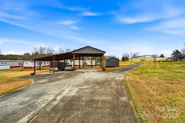 a front view of a house with a swimming pool