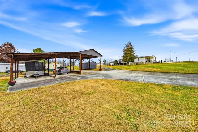 a swimming pool with outdoor seating and yard