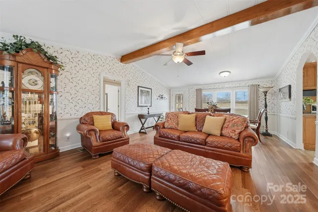 a bedroom with furniture and wooden floor
