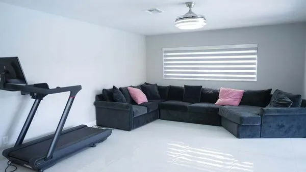 a living room with furniture and a window