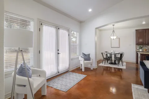 a living room with furniture and a table