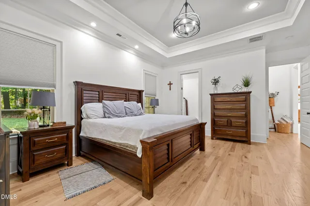a bedroom with a bed and a dresser