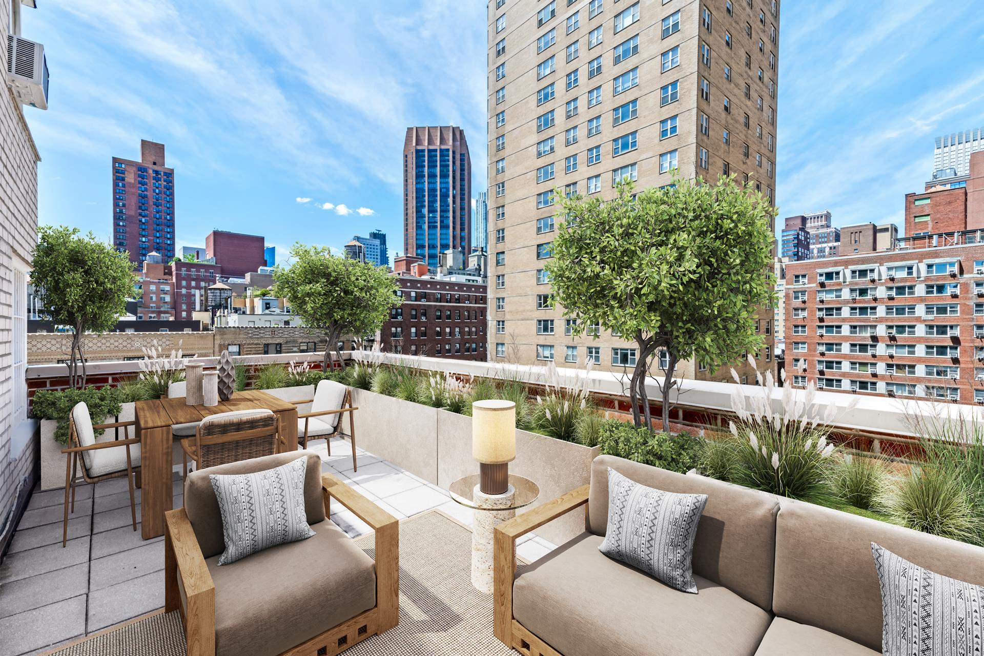 150 East 37th Street, Unit 12C Manhattan, NY 10016 - Photo 4 of 6 a view of a patio with couches and a table and chairs with wooden floor and plants