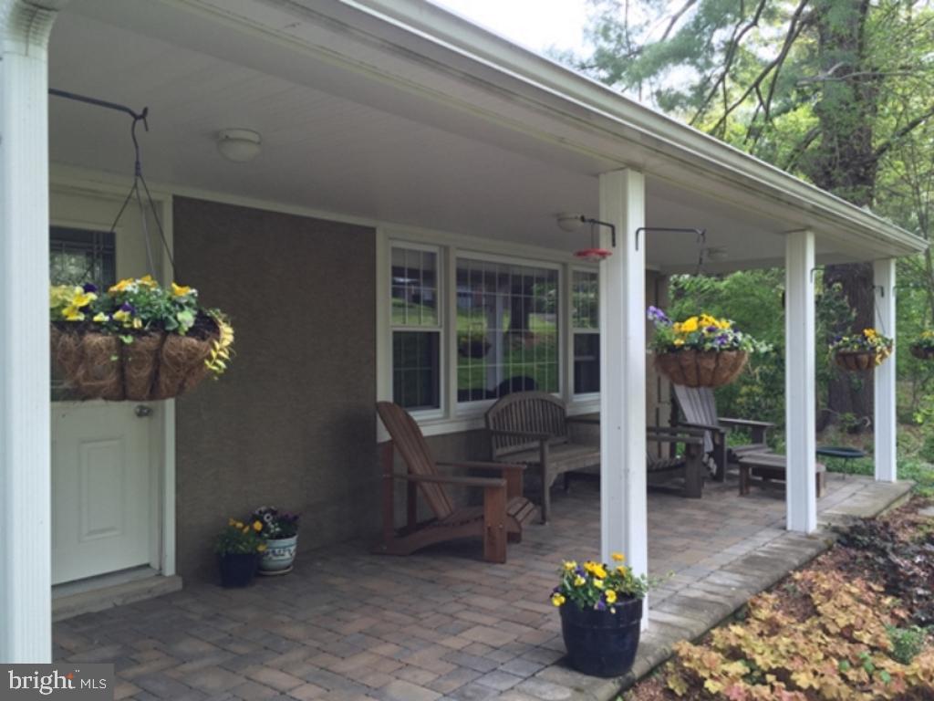 532 Painter Road Media, PA 19063 - Photo 5 of 59 Front porch with Spring flowers