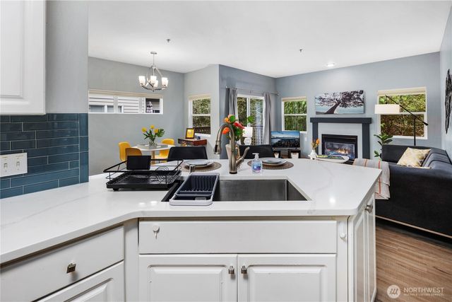a view of kitchen sink and fireplace