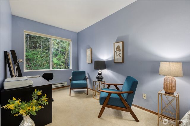 a workspace with furniture and a window