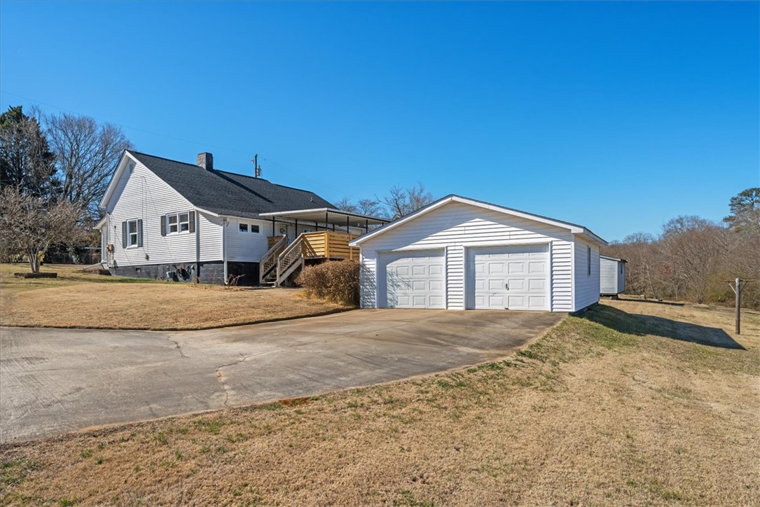 This charming home offers ample outdoor space and a detached garage, perfect for your needs.